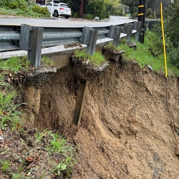 Photo showing erosion under the road on Benedict Canyon.